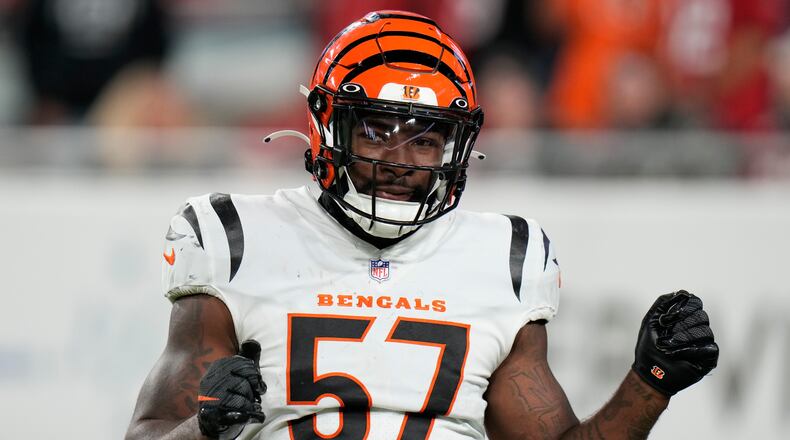 Cincinnati Bengals linebacker Germaine Pratt (57) celebrates his interception against Tampa Bay Buccaneers quarterback Tom Brady during the second half of an NFL football game, Sunday, Dec. 18, 2022, in Tampa, Fla. (AP Photo/Chris O'Meara)
