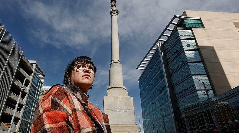 Carly Risenhoover-Peterson at the Civil War monument at Main and Monument in downtown Dayton. MARSHALL GORBY\STAFF