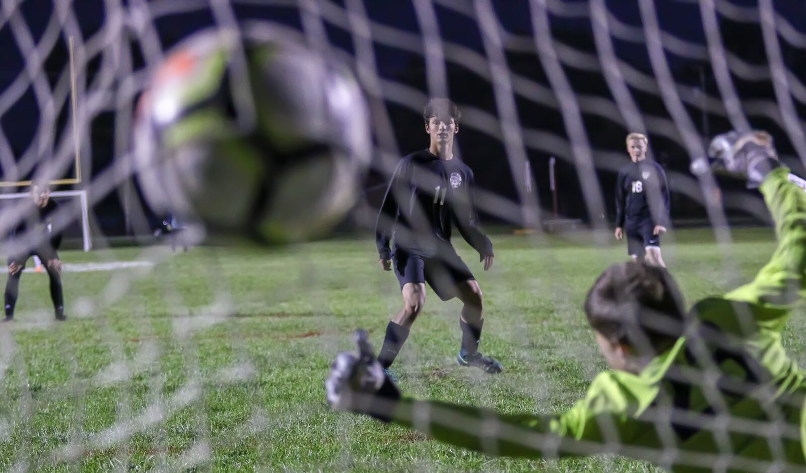 Greenon High School sophomore Damien Beck scores on a penalty kick during the Knights 9-0 victory over Preble Shawnee on Monday, Oct. 15. The Knights have won 13 straight games heading into a sectional final match with Waynesville on Monday. Michael Cooper/CONTRIBUTED