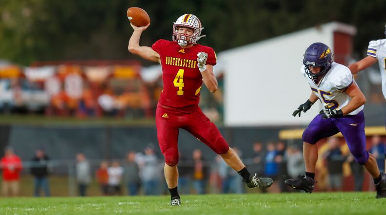 Northeastern High School senior quarterback Cade Houseman rolls out to pass during their game against Mechanicsburg on Friday night at Conover Field in Springfield. The Jets won 42-21. CONTRIBUTED PHOTO BY MICHAEL COOPER
