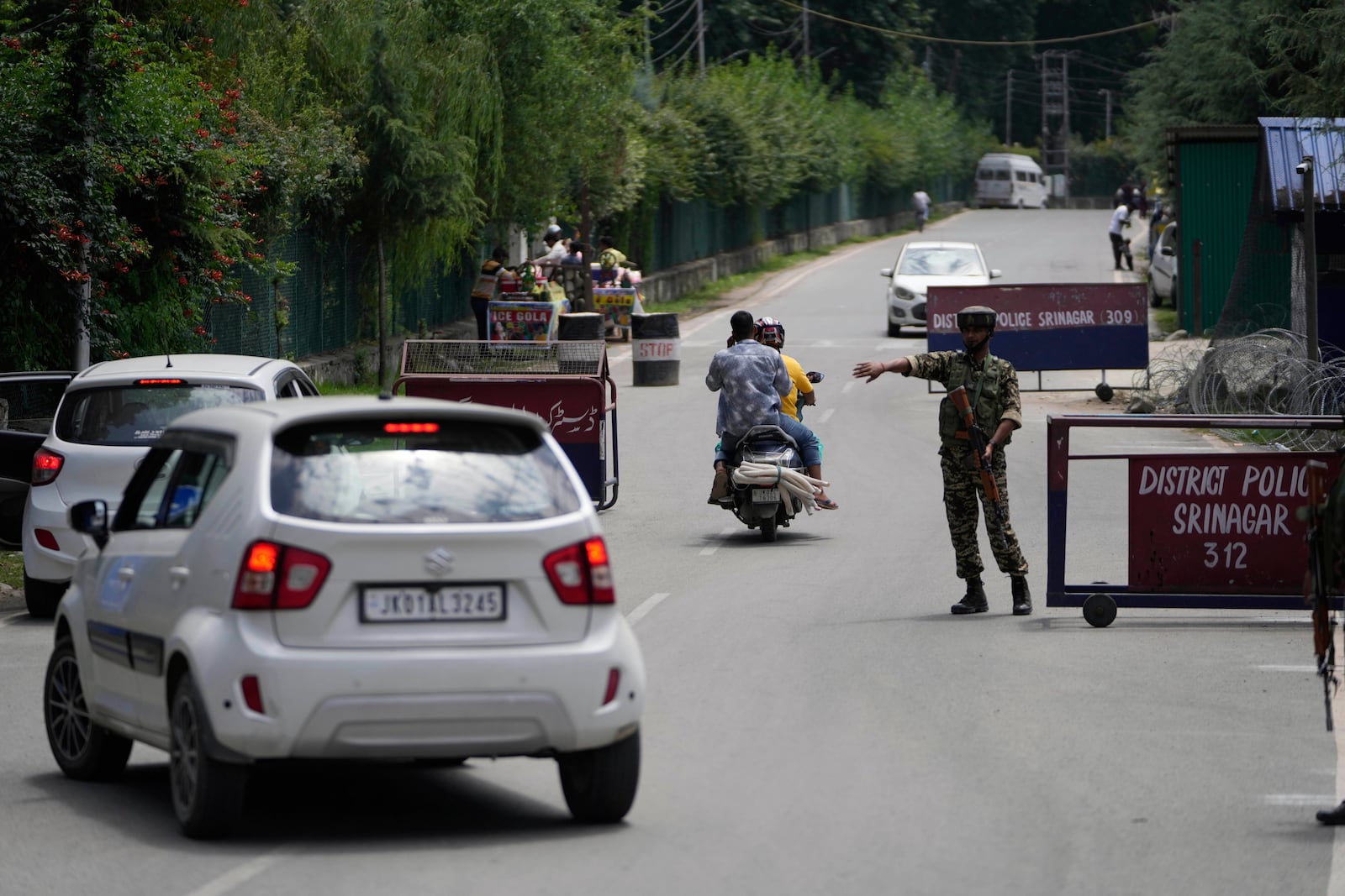 An Indian soldier guards at a check point near the site of a gun battle on the outskirts of Srinagar, Indian controlled Kashmir, Monday, July 28, 2025.(AP Photo/Mukhtar Khan)