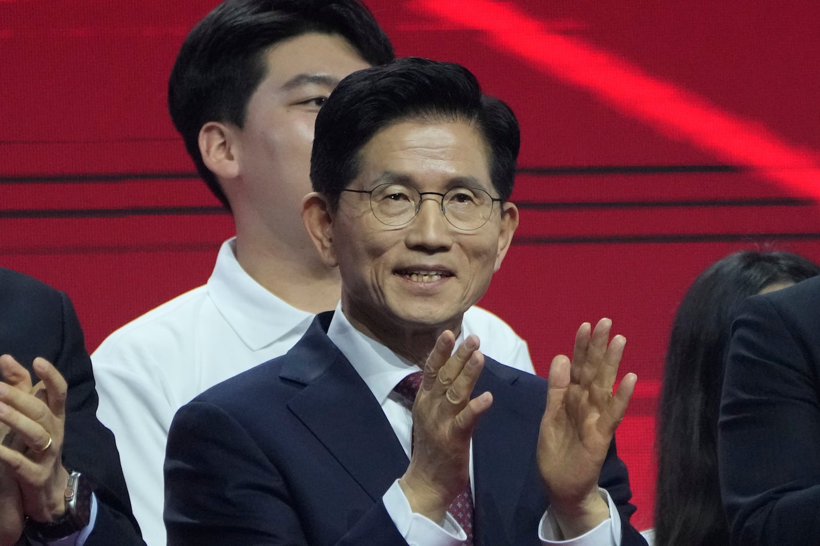 South Korea's former Labor Minister Kim Moon Soo celebrates after winning the nomination as the presidential election candidate during the People Power Party's convention in Goyang, South Korea, Saturday, May 3, 2025. (AP Photo/Ahn Young-joon)