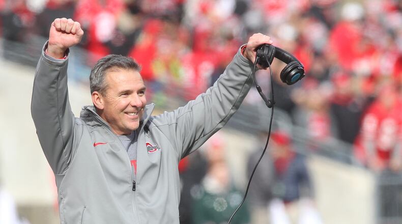 Ohio State coach Urban Meyer celebrates a tackle by the special teams against Michigan State on Saturday, Nov. 11, 2017, at Ohio Stadium in Columbus. David Jablonski/Staff