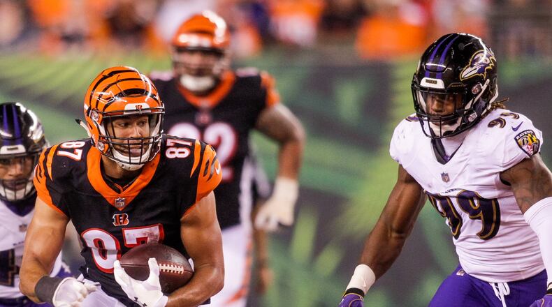 Cincinnati Bengals C.J. Uzomah carries the bal lafter making a catch during their game against the Baltimore Ravens Thursday, Sept. 13 at Paul Brown Stadium in Cincinnati. The Cincinnati Bengals defeated the Baltimore Ravens 34-23. NICK GRAHAM/STAFF