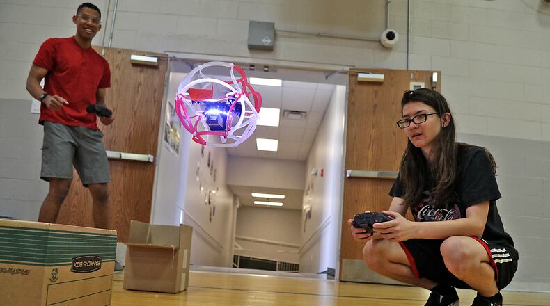 Participants in the manufacturing camp at The Dome practice with small drones so they can play drone soccer Monday, June 6, 2022. The camp was organized by U.S. Senator Sherrod Brown and the My Brother's Keeper Springfield Chapter. BILL LACKEY/STAFF