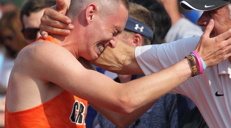 Beavercreek’s Riley Buchholz wins the 1,600-meter race at the Division I state track and field championships on Saturday, June 1, 2019, at Jesse Owens Memorial Stadium in Columbus. David Jablonski/Staff