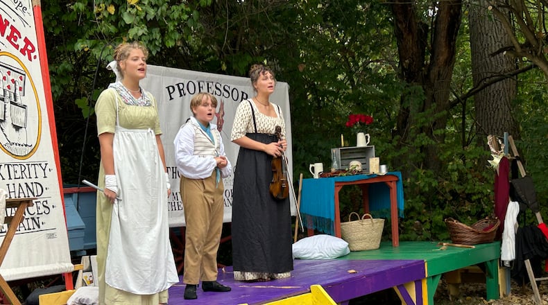 After years of attending the Fair at New Boston as reenactors, Olivia Fashian, left, Caleb Wachtman and Ava Wachtman formed their own act, the Wandering Minstrels of Rush Acadamie, performing a blend of music and comedy that debuted on Saturday at George Rogers Clark Park. CONTRIBUTED PHOTO BY BRETT TURNER