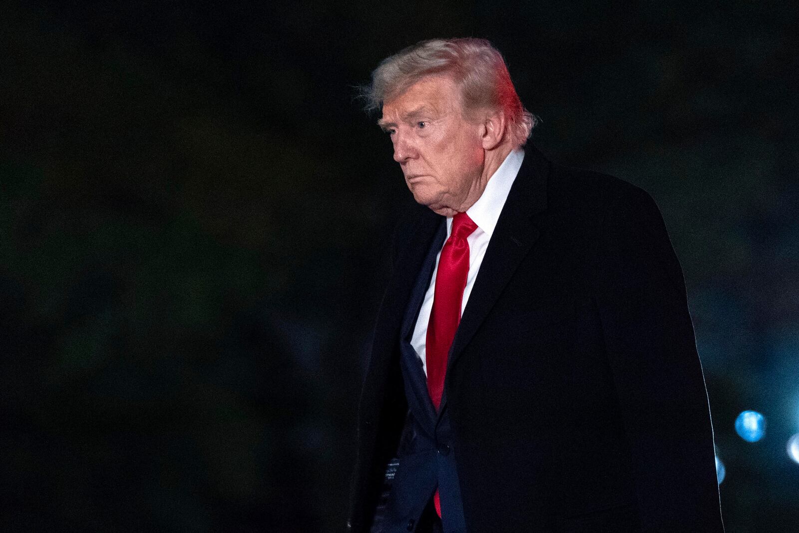 President Donald Trump walks on the South Lawn of the White House in Washington, Sunday, April 13, 2025. (AP Photo/Jose Luis Magana)