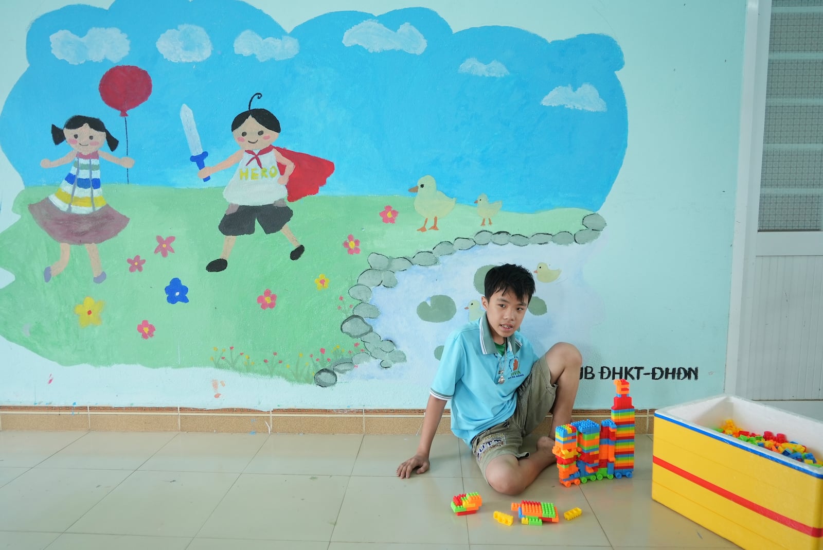 Nguyen Van Quoc Hung, 13, plays with building blocks at a school for victims of Agent Orange in Da Nang, Vietnam, March 7, 2025. (AP Photo/Hau Dinh)