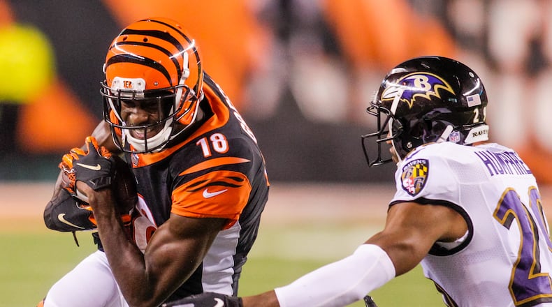 Cincinnati Bengals wide receiver A.J. Green carries the ball in for a touchdown during their game against the Baltimore Ravens Thursday, Sept. 13 at Paul Brown Stadium in Cincinnati. The Cincinnati Bengals defeated the Baltimore Ravens 34-23. NICK GRAHAM/STAFF