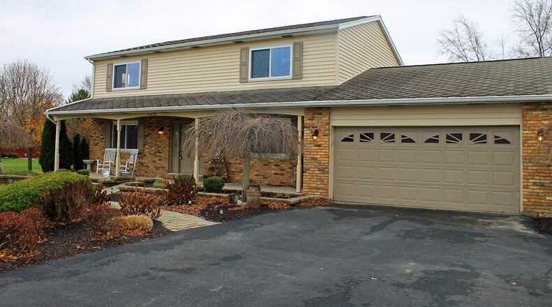 A covered porch spans the front of the 4-bedroom home. CONTRIBUTED PHOTOS BY VICKIE KAPNAS