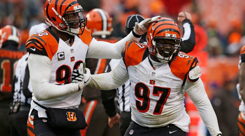 Cincinnati Bengals defensive tackle Geno Atkins (97) is congratulated after a sack in the second half of an NFL football game against the Cleveland Browns, Sunday, Dec. 11, 2016, in Cleveland. (AP Photo/Ron Schwane)