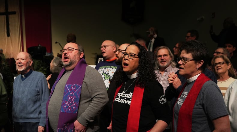 Faith leaders sing together as a sign of support for Haitian migrants fearing the end of their Temporary Protected Status in the U.S., at an event held at St. John Missionary Baptist Church in Springfield, Ohio on Monday, Feb. 2, 2026. (AP Photo/Luis Andres Henao)