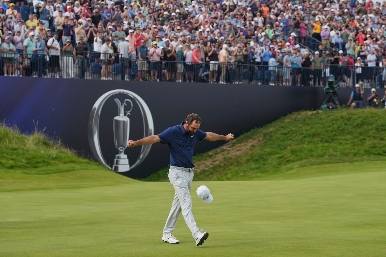 Scottie Scheffler of the United States celebrates after winning the British Open golf championship at the Royal Portrush Golf Club, Northern Ireland, Sunday, July 20, 2025. (AP Photo/Jon Super)