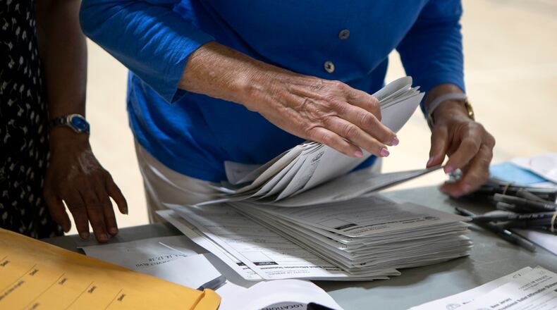 FILE -- A poll worker counts provisional ballots for the New Jersey primary in Paramus, N.J., on July 7, 2020. Despite a disjointed primary season and the challenges of holding elections during a pandemic, the Democratic Party is seeing a surge in energy among voters. (Erica Lee/The New York Times)