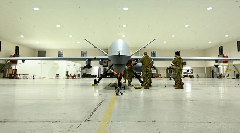 An airman assigned to the Mississippi Air National Guard's 163rd Attack Wing perform post-flight checks on an MQ-9 Reaper Mar. 12, 2024 at the 178th Wing in Springfield, Ohio. This is the first time the remotely-piloted drone has landed at the wing. CONTRIBUTED