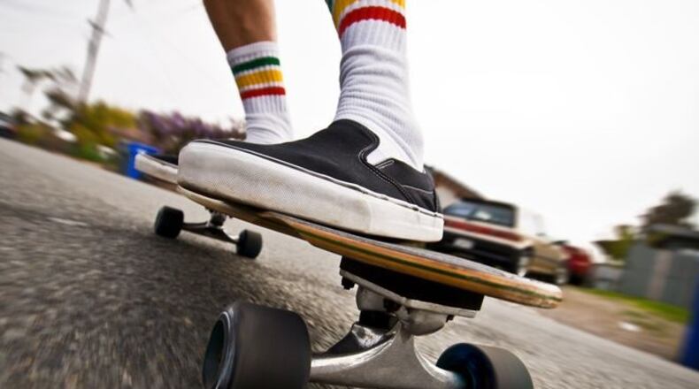 Riding a skateboard while holding a car could become illegal in Ohio
