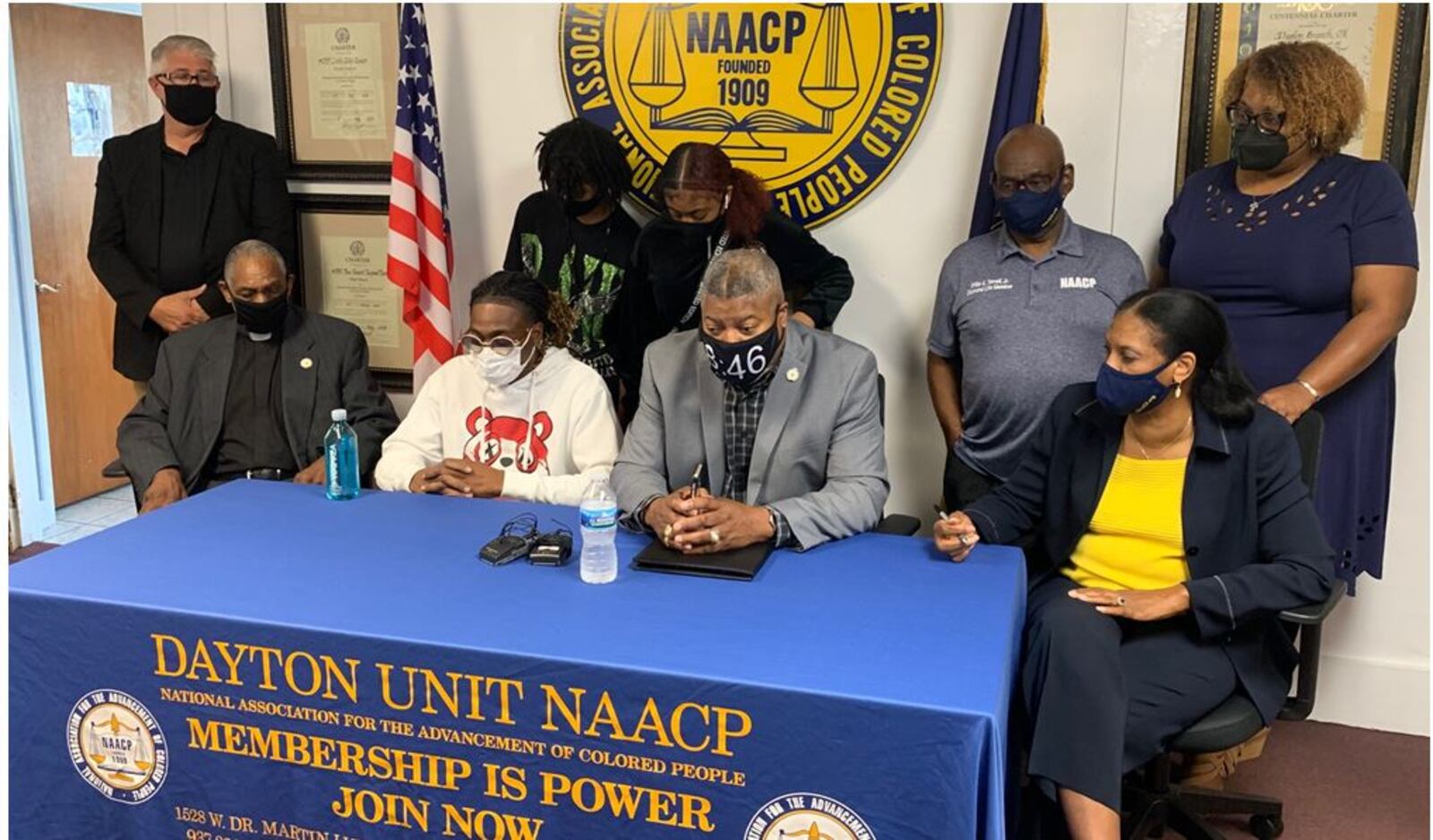 Clifford Owensby Sr., second from left, appears at a press conference Sunday with officials of the NAACP Dayton Unit to tell his side of an incident in which he was forcibly removed from his vehicle during a Sept. 30 traffic stop for an alleged window tint violation. Owensby is a paraplegic and could not step out of the vehicle as police ordered. At the table from left are the Rev. David Fox, Owensby,  Derrick Foward, NAACP Dayton unit president, and Mattie P. White, first vice president of NAACP Dayton Unit. The incident remains under investigation by police. ED RICHTER/STAFF