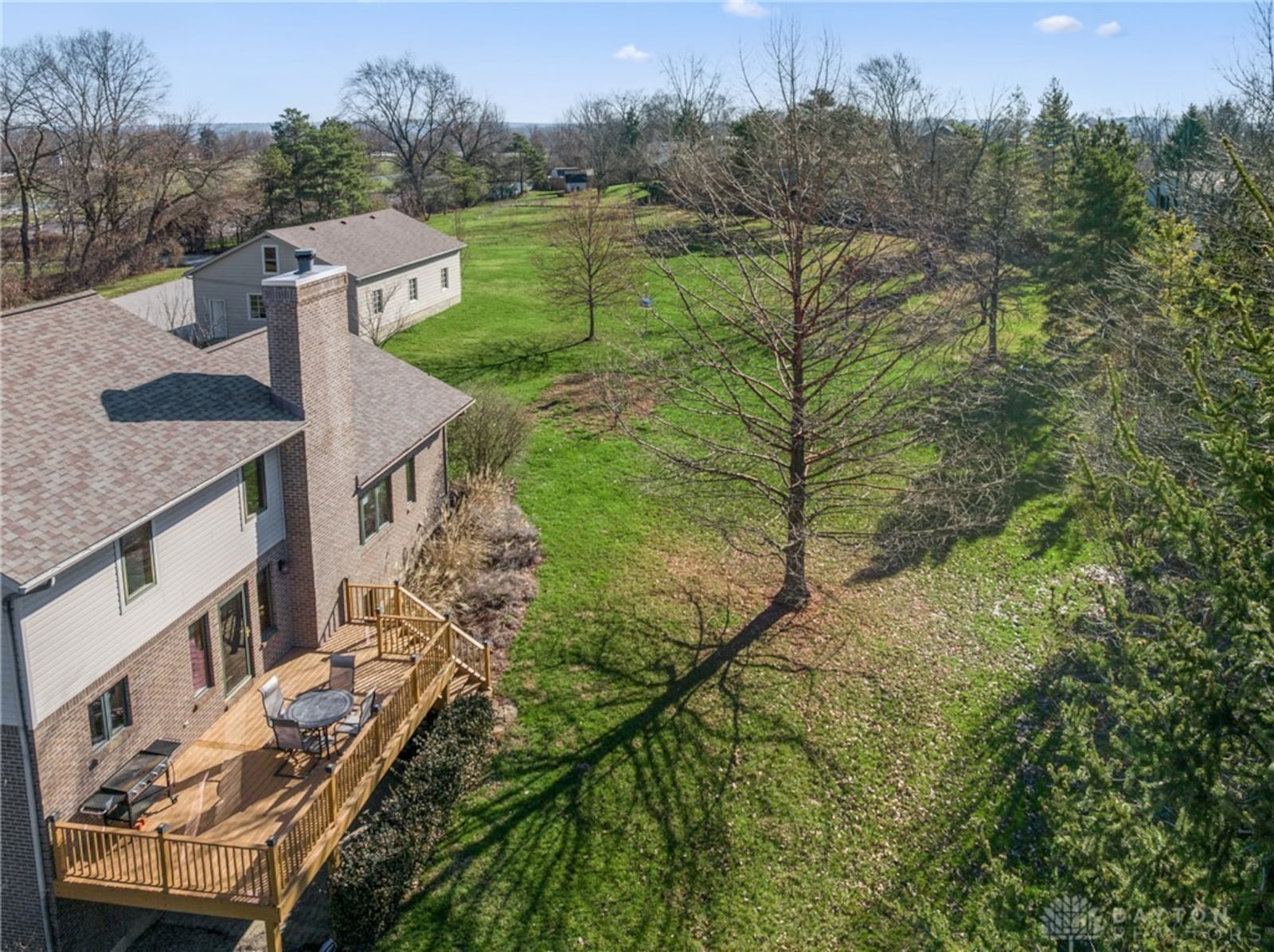 The back yard expands across both residences and the three car detached garage and is heavily wooded. CONTRIBUTED