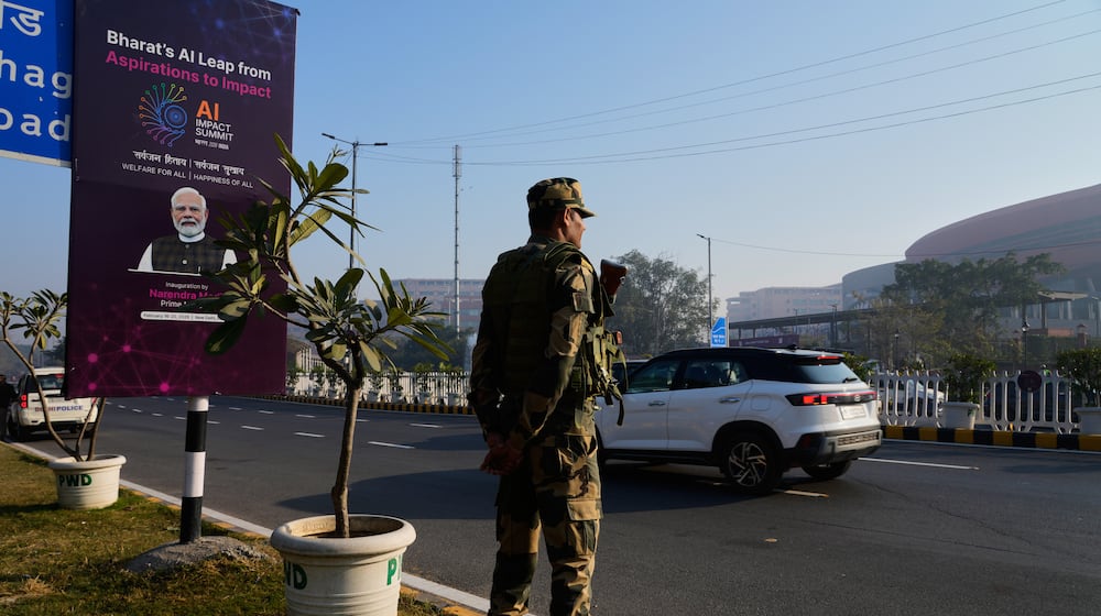 An Indian para-military force soldier stands guard outside the venue of AI-Summit in New Delhi, India, Monday, Feb. 16, 2026. (AP Photo/Manish Swarup)