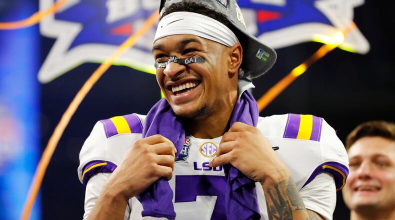 LSU safety Grant Delpit celebrates on the podium after winning the Chick-fil-A Peach Bowl 28-63 over the Oklahoma Sooners at Mercedes-Benz Stadium on December 28, 2019 in Atlanta, Georgia. (Photo by Kevin C. Cox/Getty Images)