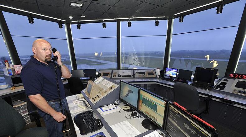 Bill Masseth, an air traffic controller at Springfield Beckley Municipal Airport, at work in the airport’s traffic control tower in 2013. Bill Lackey/Staff