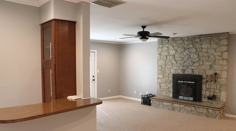 The centerpiece to the spacious family room is a stone fireplace with wood-burning insert. Contributed photos by Kathy Tyler