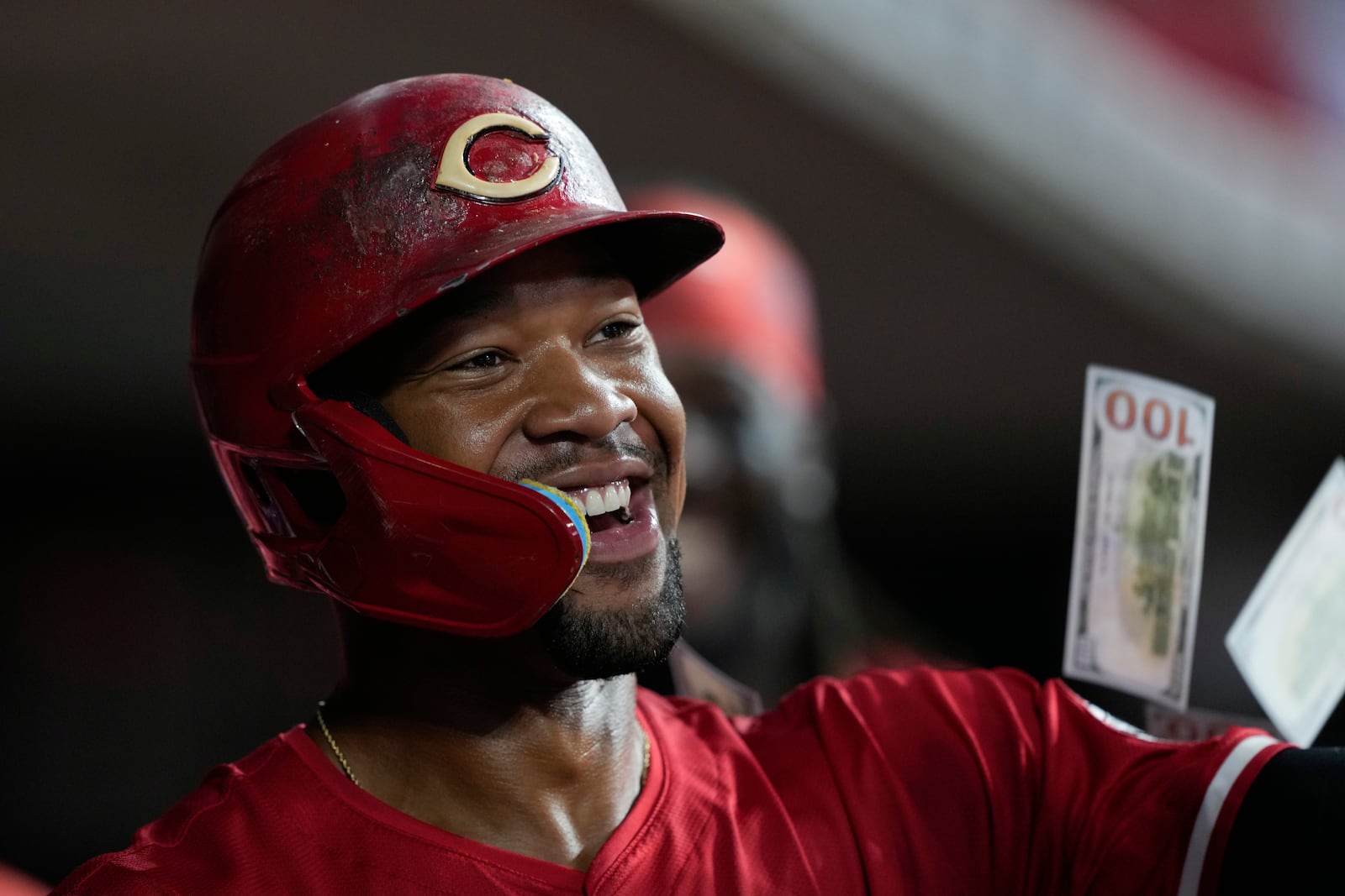 Cincinnati Reds' Will Benson celebrates in the dugout after hitting a solo home run during the eighth inning of a baseball game against the Miami Marlins in Cincinnati, Wednesday, July 9, 2025. (AP Photo/Carolyn Kaster)