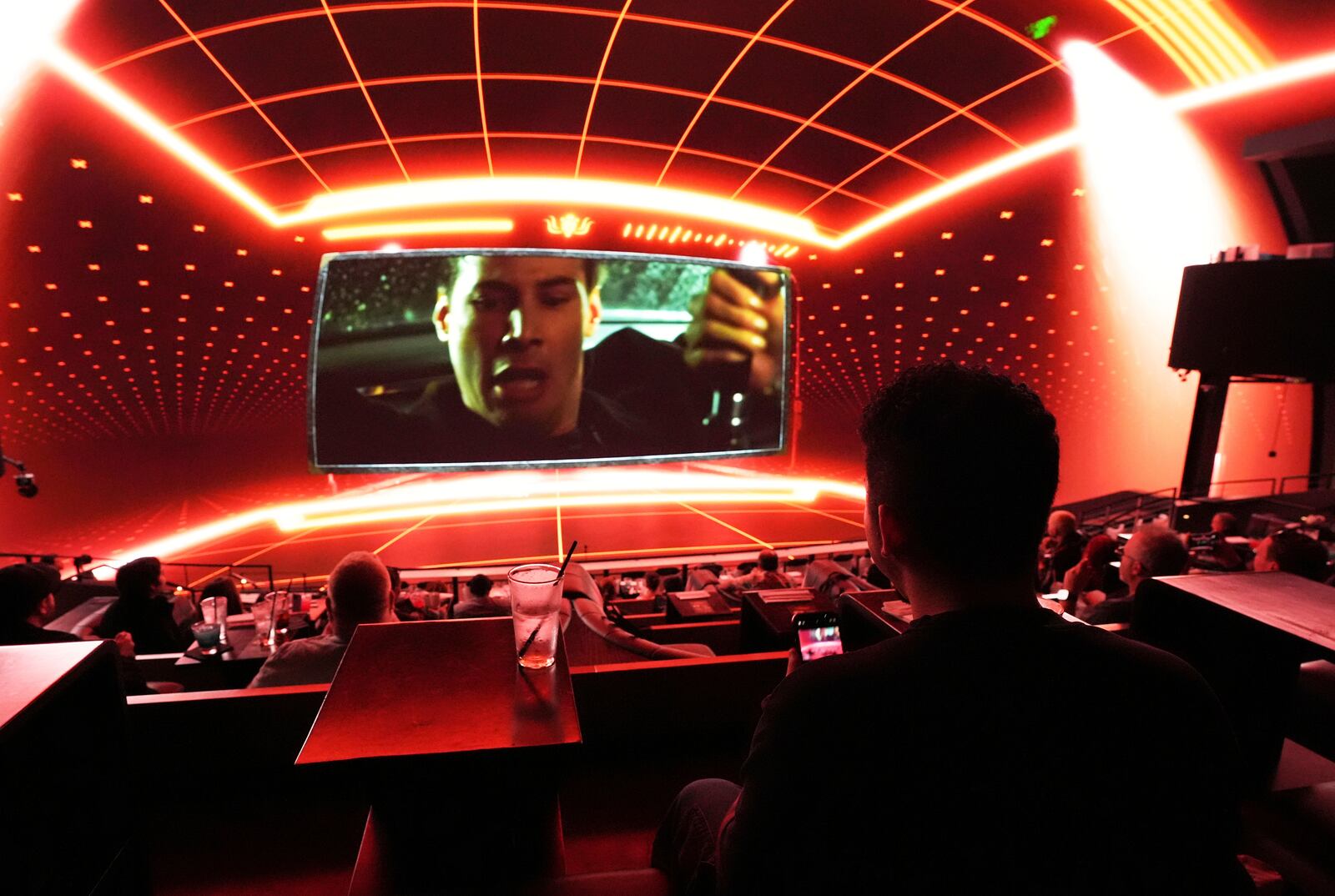 Immersive visuals surround a scene from the film "The Matrix" during a press preview for "The Matrix in Shared Reality" on Wednesday, May 28, 2025, at Cosm Los Angeles in Inglewood, Calif. (AP Photo/Chris Pizzello)