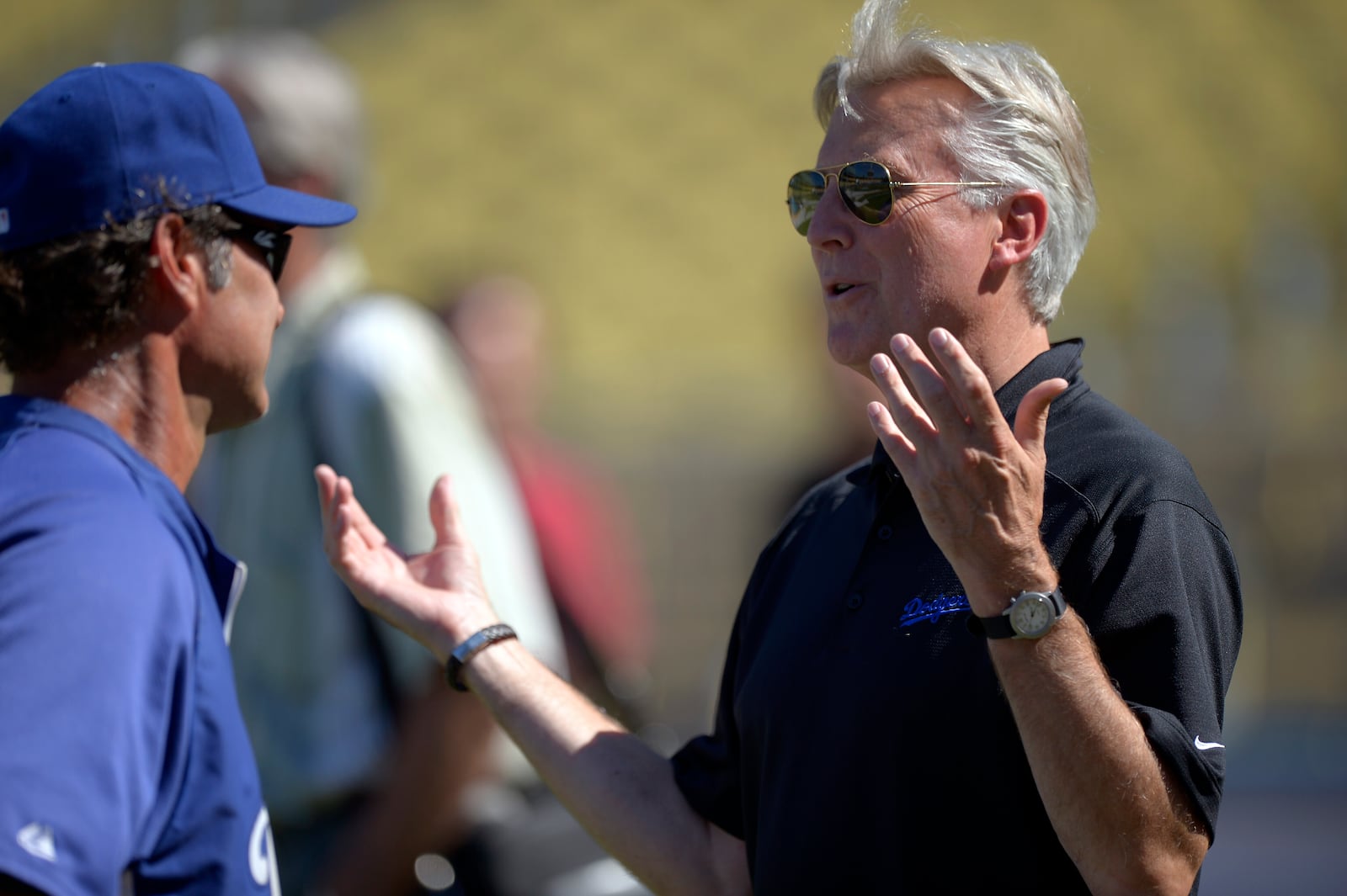 FILE - Los Angeles Dodgers co-owner Mark Walter, right, talks with manager Don Mattingly prior to their baseball game against the San Diego Padres, Sept. 3, 2012, in Los Angeles. (AP Photo/Mark J. Terrill, File)