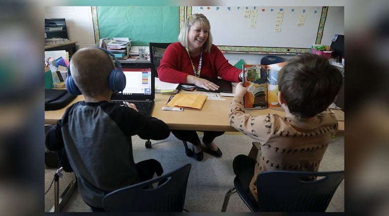 Ashley DuGan works with students in the Learning Recovery program at Northwestern Elementary School. BILL LACKEY/STAFF