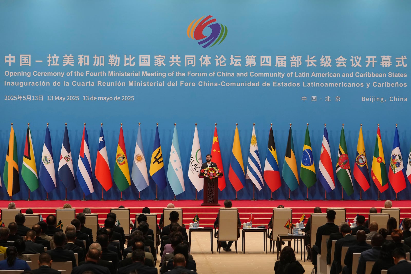 Chilean President Gabriel Boric delivers his speech on stage during the opening ceremony of the Fourth Ministerial Meeting of the Forum of China and Community of Latin American and Caribbean States at China National Convention Center in Beijing, Tuesday, May 13, 2025. (AP Photo/Andy Wong)