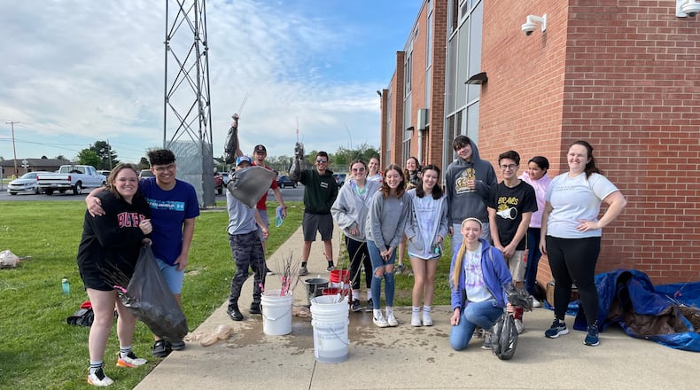Clark-Shawnee High School students will hold a tree-planting event on May 4 where residents can buy saplings or volunteer to plant trees in local yards to help offset the school's energy consumption. Here, students helped during last year's Tree-Plenish event held on May 6. This was the first Tree-Plenish event at Shawnee High School. Contributed