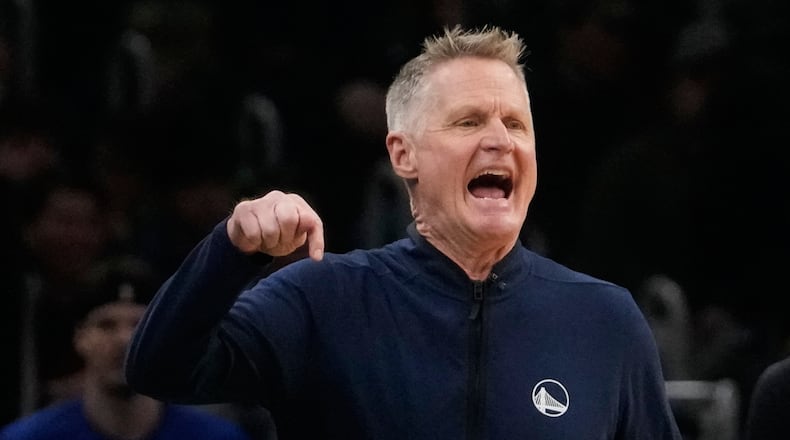 Golden State Warriors head coach Steve Kerr calls to his players during the first half of an NBA basketball game against the Boston Celtics, Wednesday, March 18, 2026, in Boston. (AP Photo/Charles Krupa)
