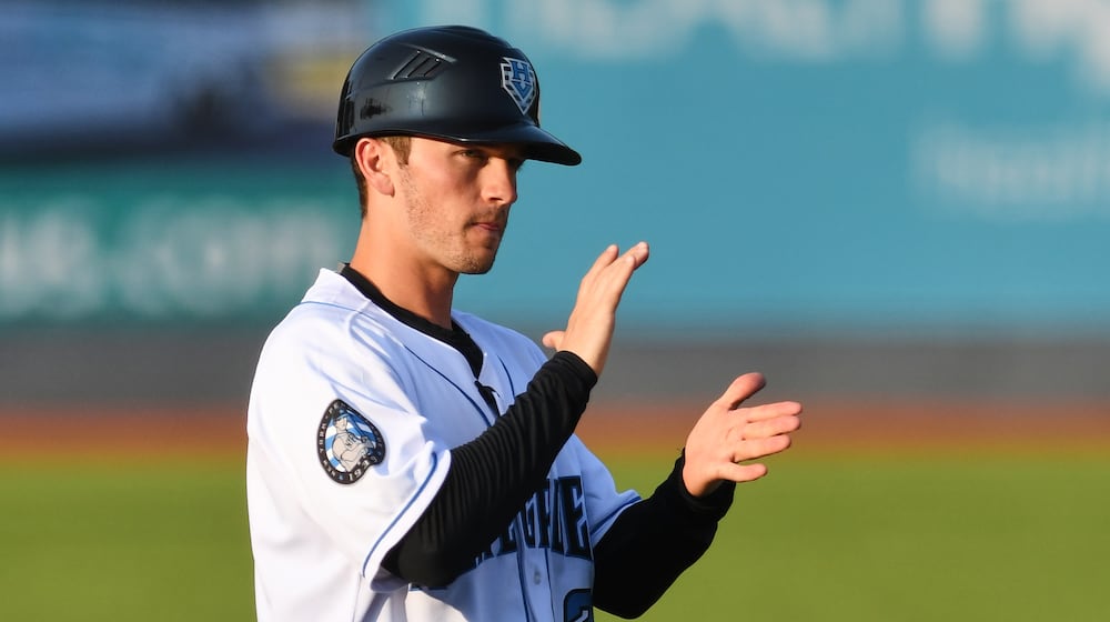 In this image provided by the Hudson Valley Renegades, Hudson Valley Renegades manager Blake Butera claps during a minor league baseball game in Wappingers Falls, N.Y., in 2019. (Roy Notaro/Hudson Valley Renegades via AP)
