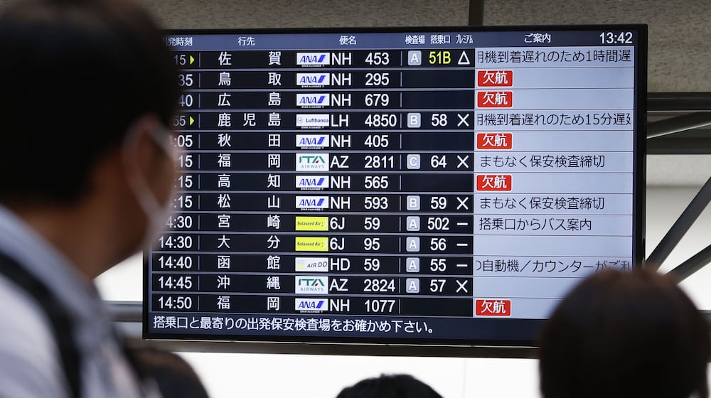 The departures display board shows All Nippon Airways' multipule flights cancellation at Haneda airport in Tokyo Saturday, Nov. 29, 2025. (Takahiko Kanbara/Kyodo News via AP)
