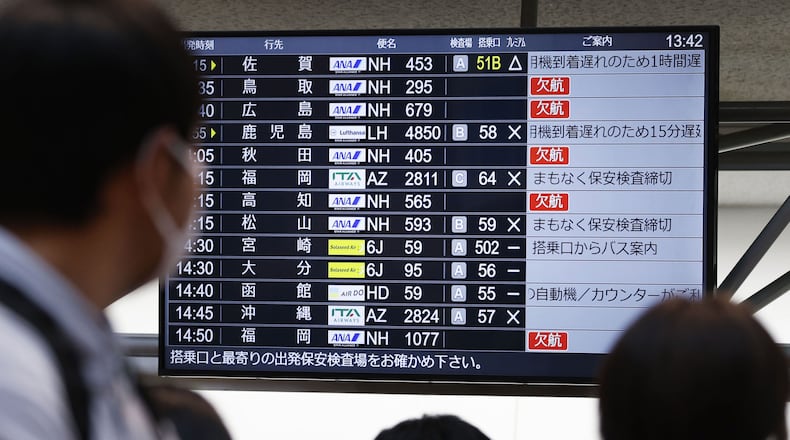 The departures display board shows All Nippon Airways' multipule flights cancellation at Haneda airport in Tokyo Saturday, Nov. 29, 2025. (Takahiko Kanbara/Kyodo News via AP)