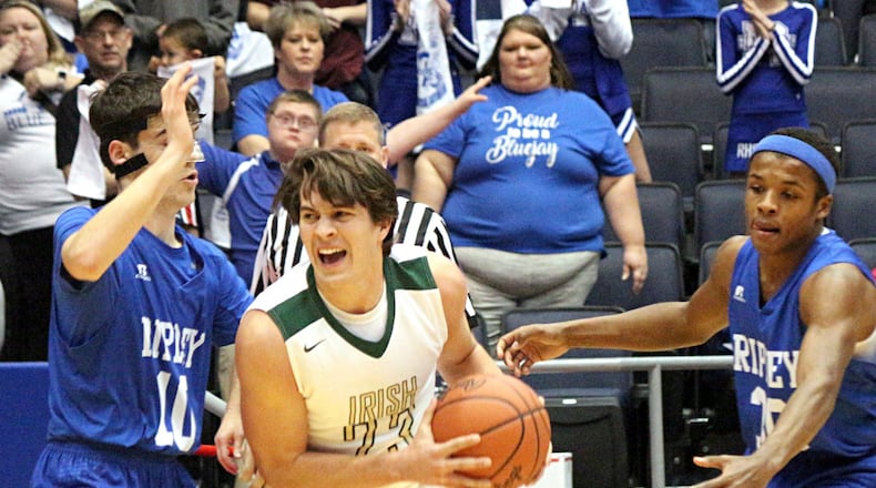 Catholic Central senior Dominic DeWitt (with ball) was among the many key baseball returners who helped the Irish make a deep basketball playoff run. GREG BILLING / CONTRIBUTED