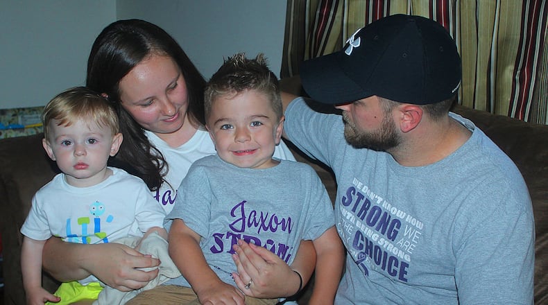 Justin and Lindsey Menda and their children (left) Wesley and Jaxon. Jaxon has a rare disease that only affects 1 in 100 thousand newborns. JEFF GUERINI/STAFF