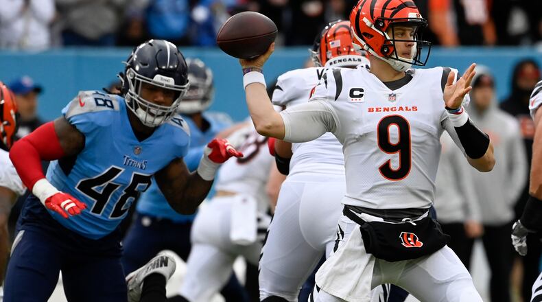 Cincinnati Bengals quarterback Joe Burrow (9) works in the pocket against the Tennessee Titans during the first half of an NFL football game, Sunday, Nov. 27, 2022, in Nashville, Tenn. (AP Photo/Mark Zaleski)