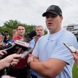 FILE - Cincinnati Bengals defensive end Trey Hendrickson speaks to media during NFL football practice on May 13, 2025, in Cincinnati. (AP Photo/Carolyn Kaster, file)