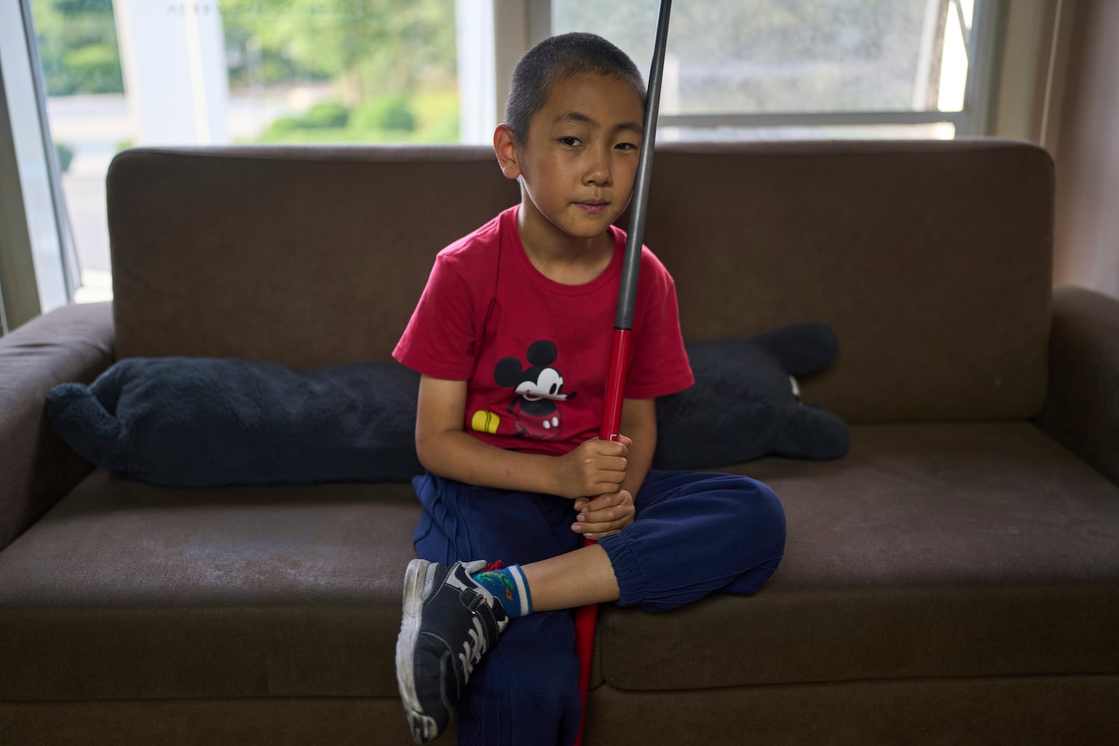 Li Zelei, 8 years old, rests during practice at the Beijing Xinrui Billiard Academy in Beijing, Tuesday, May 6, 2025. (AP Photo/Ng Han Guan)