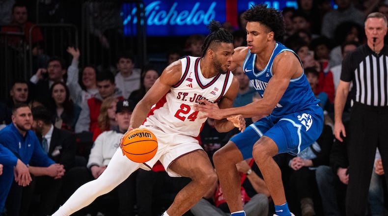 St. John's forward Zuby Ejiofor (24) drives toward the basket during the first half of an NCAA college basketball game against Xavier, Monday, Feb. 9, 2026, in New York. (AP Photo/Angelina Katsanis)