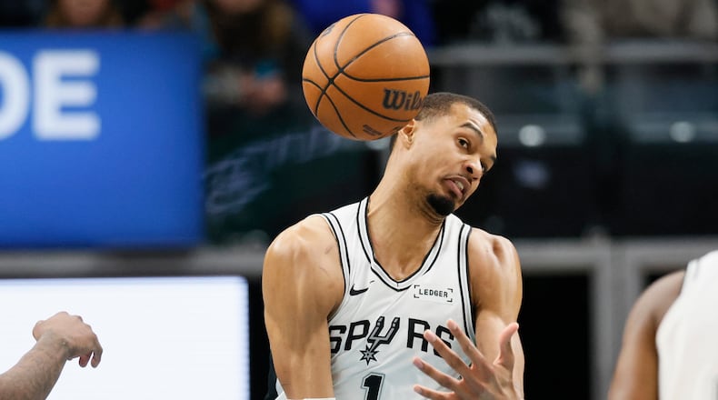 San Antonio Spurs forward Victor Wembanyama cannot grab a rebound during the first half of an NBA basketball game against the Detroit Pistons, Monday, Feb. 23, 2026, in Detroit. (AP Photo/Duane Burleson)