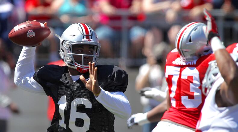 Ohio State's J.T. Barrett throws a pass in the spring game on Saturday, April 16, 2016, at Ohio Stadium in Columbus. David Jablonski/Staff