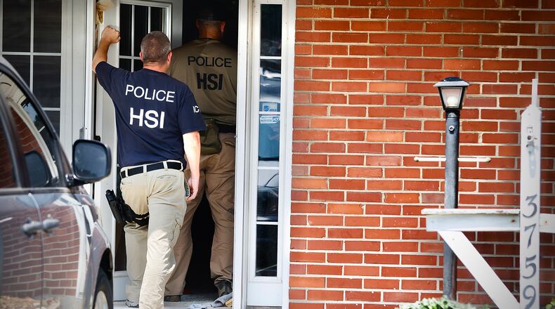 Homeland security, searching a home at 3759 Woodbury Dr., Friday, July 26, 2024. MARSHALL GORBY \STAFF