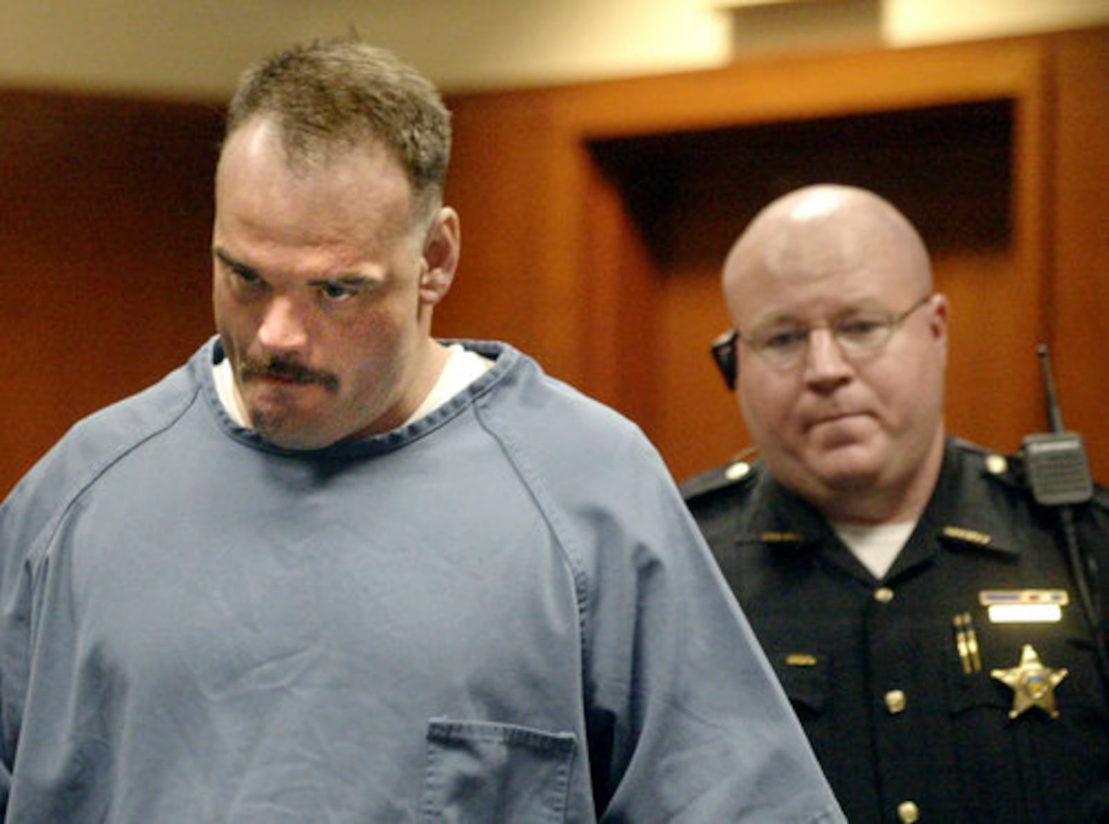 Christian Gabriel is led into Montgomery County Common Pleas Court Thursday, June 16, 2005, for a hearing to evaluate whether statements made by Gabriel can be used at his trial. Gabriel is charged with gross abuse of a corpse and tampering with evidence in the disappearance of 9-year-old Erica Baker more than six years ago in Kettering, Ohio.