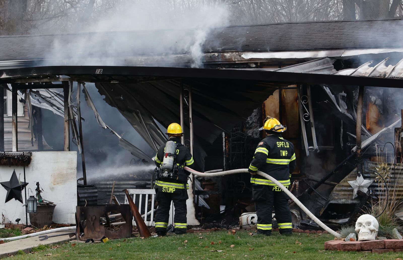 Springfield Twp. Firefighters battle a mobile home fire on South Tecumseh Road Tuesday, Nov. 29, 2022. BILL LACKEY/STAFF