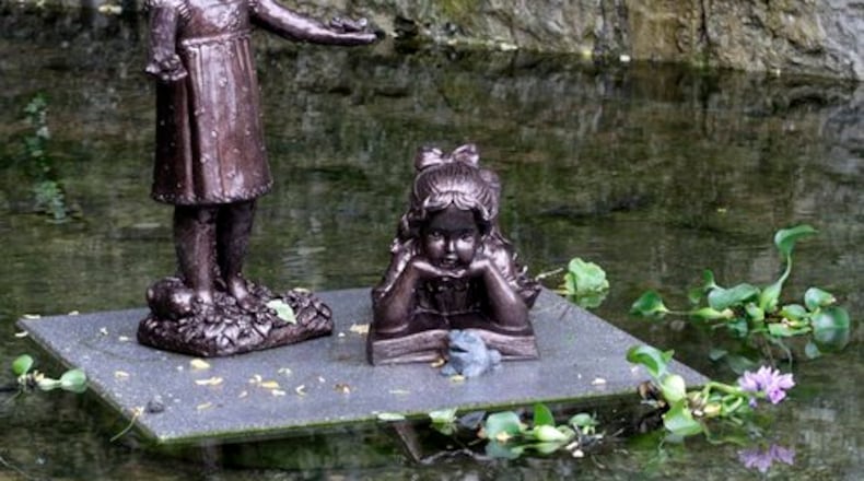Family and friends gathered for the dedication of a sanctuary at the site where Martha Leach, 11, and Phree Morrow, 12, were murdered in an alley behind Schuler's Bakery on West Main Street in August 1992.