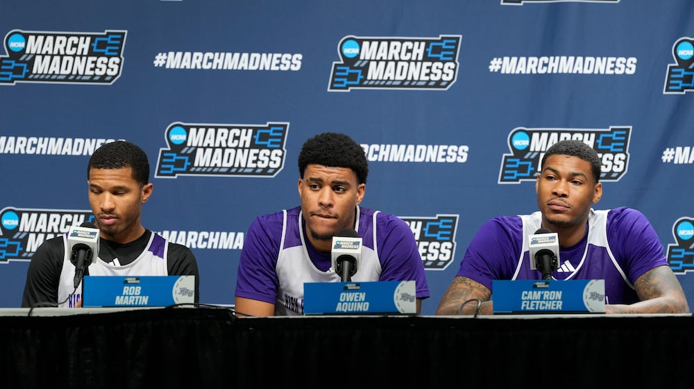 From left to right, High Point guard Rob Martin, forward Owen Aquino and forward Cam'ron Fletcher listen during a news conference prior to the second round of the NCAA college basketball tournament Friday, March 20, 2026, in Portland, Ore. (AP Photo/Jenny Kane)